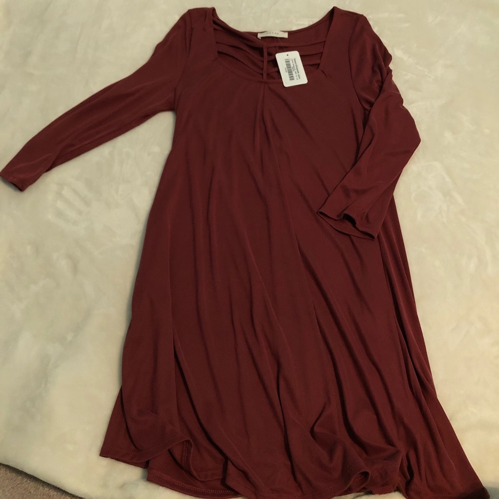 Deep red/burgundy swing dress with cut of details